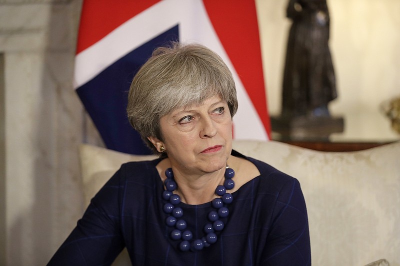 British Prime Minister Theresa May turns to listen to a translator during her meeting with Spanish Prime Minister Mariano Rajoy inside 10 Downing Street in London, Tuesday, Dec. 5, 2017. (AP Photo/Matt Dunham, Pool)