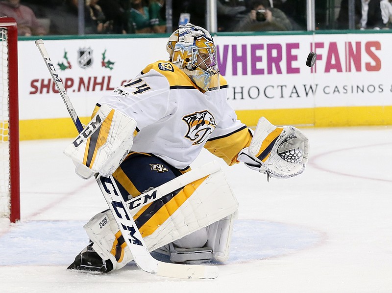 Nashville Predators goalie Juuse Saros watches a shot from the Dallas Stars during the first period of an NHL hockey game, Tuesday, Dec. 5, 2017, in Dallas. (AP Photo/Tony Gutierrez)