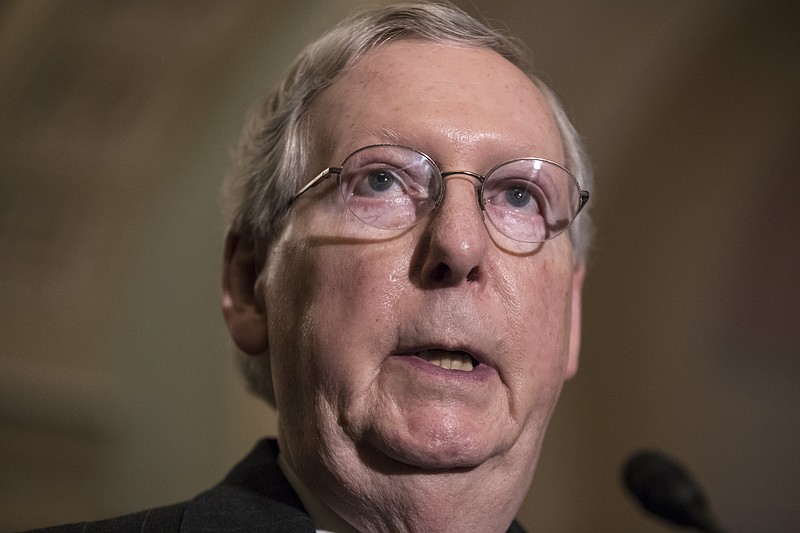 In this Dec. 5, 2017, photo, Senate Majority Leader Mitch McConnell, R-Ky., speaks on Capitol Hill in Washington. The pace of confirmations for President Donald Trump's judicial nominees has quickly become a source of pride for Senate Majority Leader Mitch McConnell and fellow Republicans while Democrats are ruing the day they changed the rules to make it easier to fast-track court picks. (AP Photo/J. Scott Applewhite)