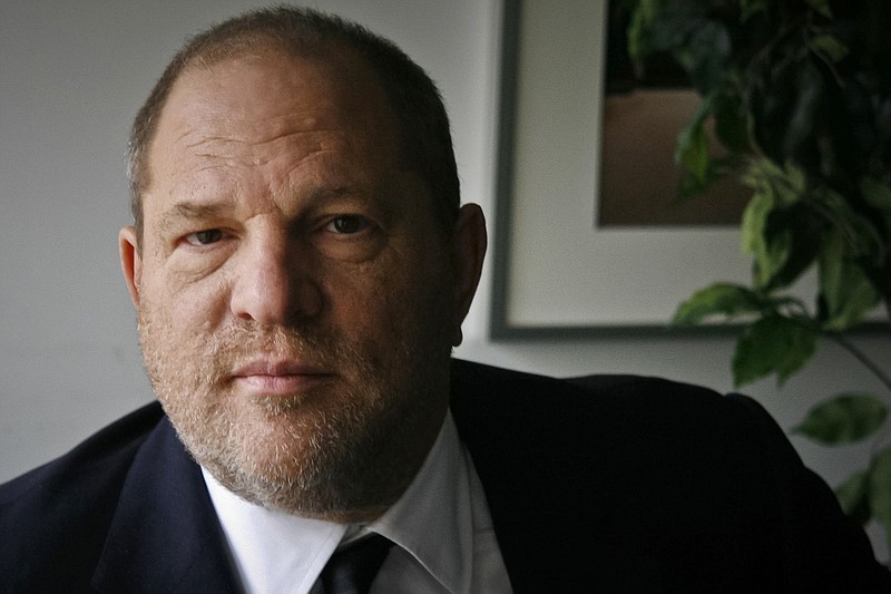 In this Nov. 23, 2011, file photo, film producer Harvey Weinstein poses for a photo in New York. Six women filed a federal lawsuit against Weinstein on Wednesday, Dec. 6, 2017, claiming that the movie mogul's actions to cover up assaults amounted to civil racketeering. (AP Photo/John Carucci, File)