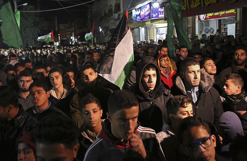 Hamas supporters stage a protest against the possible U.S. decision to recognize Jerusalem as Israel's capital, in Jebaliya Refugee Camp, Gaza Strip, Wednesday, Dec. 6, 2017. President Donald Trump is forging ahead with plans to recognize Jerusalem as Israel's capital despite intense Arab, Muslim and European opposition to a move that would upend decades of U.S. policy and risk potentially violent protests. (AP Photo/Adel Hana)