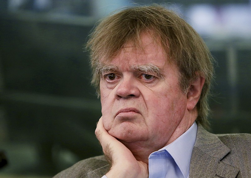 In this Sept. 30, 2014 file photo, Garrison Keillor talks with Daily Circuit host Tom Weber in the studios at Minnesota Public Radio in St. Paul, Minn. The president of Minnesota Public Radio has told employees the decision to cut business ties with former "A Prairie Home Companion" host Keillor resulted from "multiple allegations" that covered an extended period of time. Jon McTaggart held an off-the-record meeting with employees Wednesday, Dec. 6, 2017, a week after Keillor's dismissal was announced. (Jeffrey Thompson/Minnesota Public Radio via AP, File)