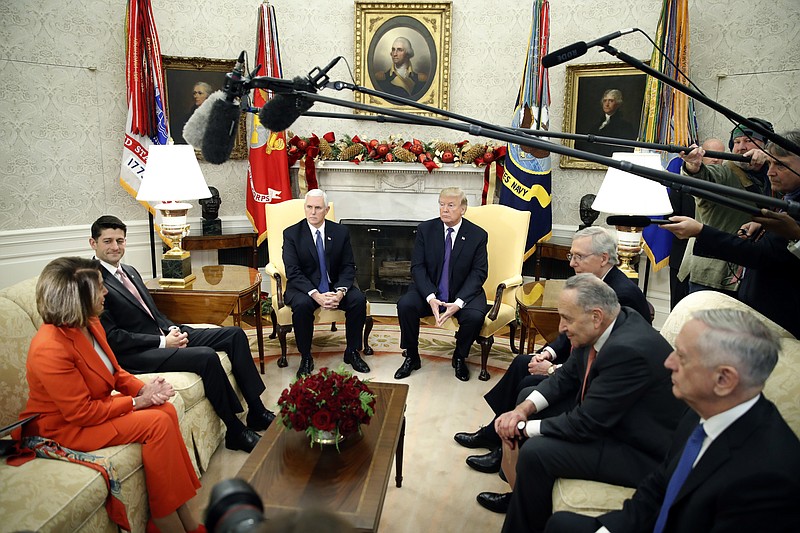 President Donald Trump accompanied by Vice President Mike Pence, meets with congressional leaders including House Minority Leader Nancy Pelosi of Calif., left, House Speaker Paul Ryan of Wis., Senate Majority Leader Mitch McConnell of Ky., Senate Minority Leader Chuck Schumer of N.Y., and Defense Secretary Jim Mattis in the Oval Office of the White House, Thursday, Dec. 7, 2017, in Washington. (AP Photo/Alex Brandon)