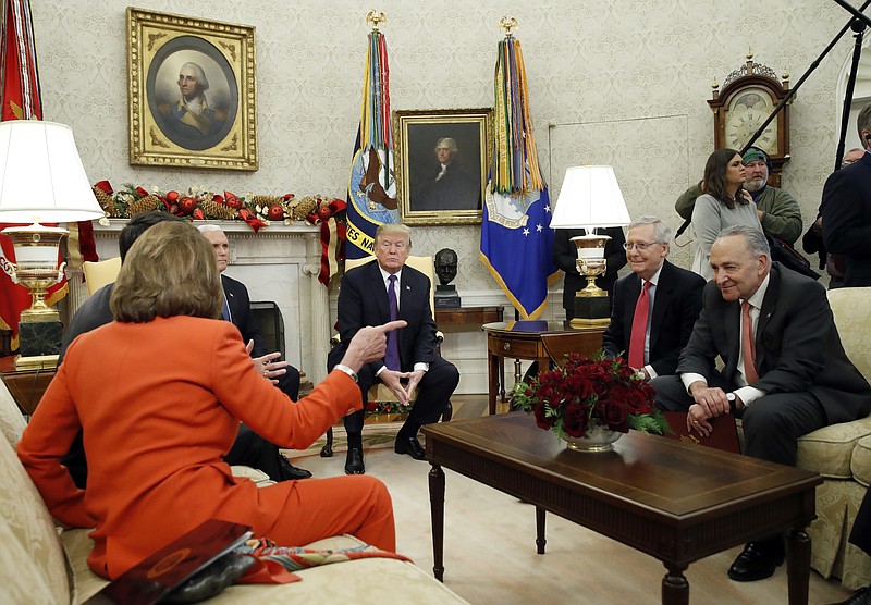 President Donald Trump accompanied by Vice President Mike Pence, listens as House Minority Leader Nancy Pelosi of Calif., speaks before a meeting with congressional leaders including House Speaker Paul Ryan of Wis., Senate Majority Leader Mitch McConnell of Ky., and Senate Minority Leader Chuck Schumer of N.Y., in the Oval Office of the White House, Thursday, Dec. 7, 2017, in Washington. (AP Photo/Alex Brandon)