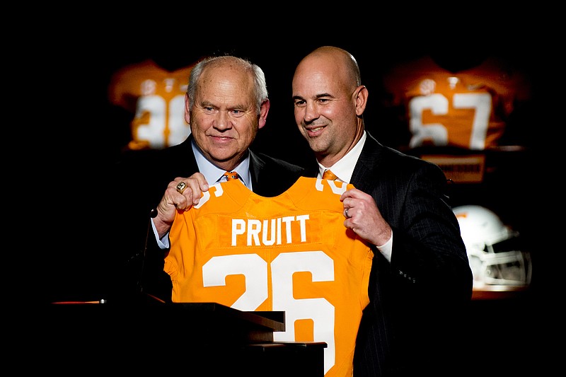 University of Tennessee athletic director Phillip Fulmer, left, introduces Jeremy Pruitt during his introduction ceremony as Tennessee's next head NCAA college football coach in Knoxville, Tenn., Thursday, Dec. 7, 2017. (Calvin Mattheis/Knoxville News Sentinel via AP)