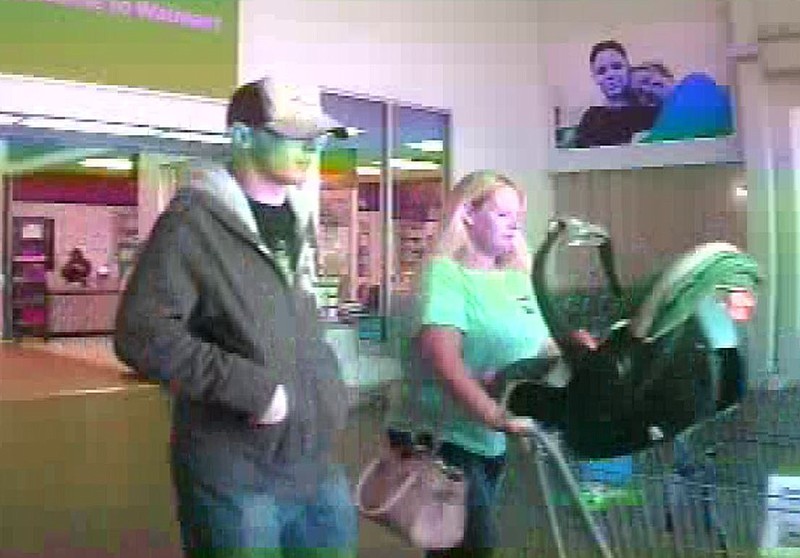 Joshua Cohen and a female suspect are seen here in video surveillance from the Walmart on Shugart Road on Nov. 28, 2017.