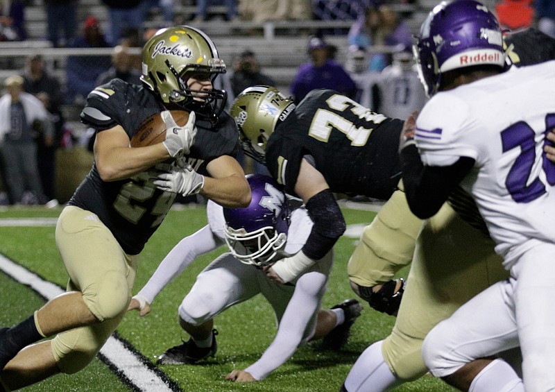 Calhoun's Zack Fuller carries during the Yellowjackets' second-round Class AAA prep football playoff game against the Monroe Area Purple Hurricanes at Calhoun High School on Friday, Nov. 17, 2017, in Calhoun, Ga.