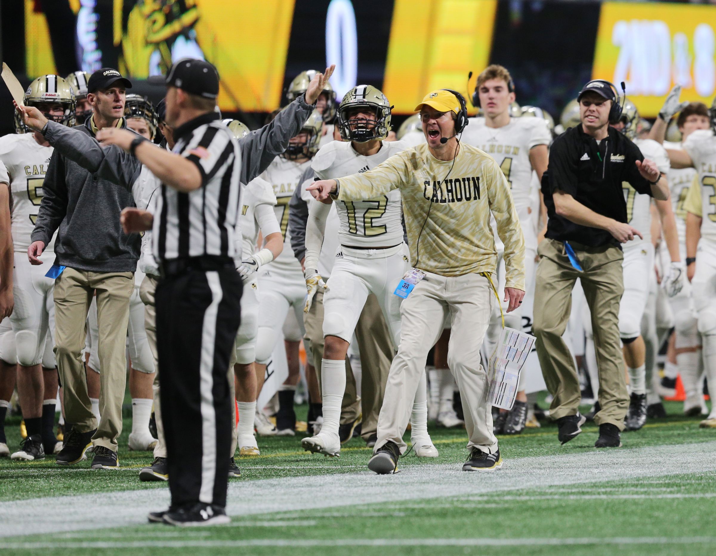 Calhoun coaches and players try to argue a call from the sidelines during the Class AAA State Championship football game between Calhoun and Peach County Friday, Dec. 8, 2017 at the Mercedes-Benz Stadium in Atlanta, Ga.