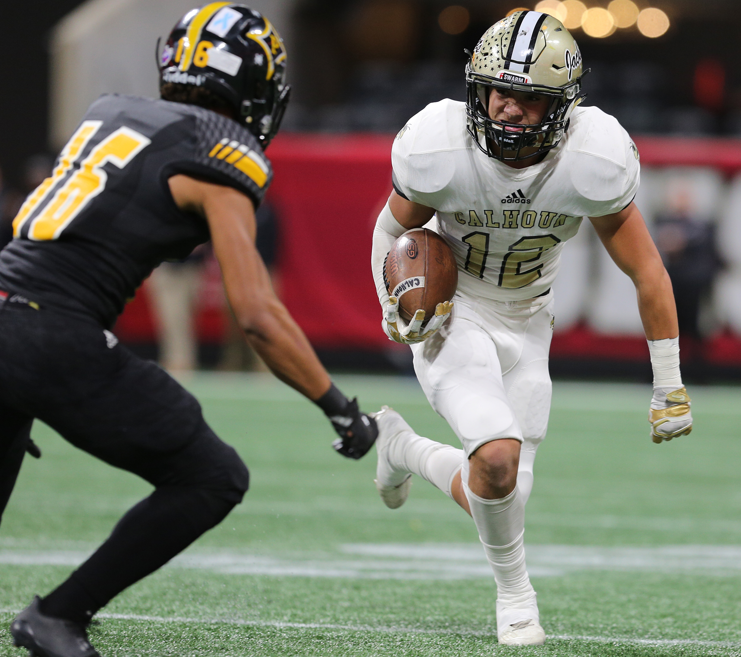 Peach County's Daelan Eason (16) chases after Calhoun's Nate Bonner (12) during the Class AAA State Championship football game between Calhoun and Peach County Friday, Dec. 8, 2017 at the Mercedes-Benz Stadium in Atlanta, Ga.