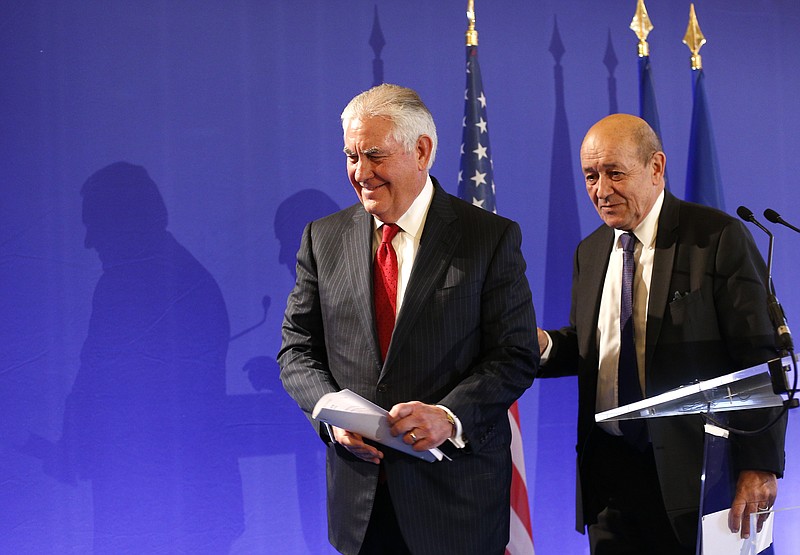 
              U.S. Secretary of State Rex Tillerson, left, and French Foreign Minister Jean-Yves le Drian leave at a summit convened by France to bolster Lebanon's institutions as it emerges from a bizarre political crisis with regional and international implications. in Paris, Friday, Dec. 8, 2017. It's the first major gathering of key nations to discuss Lebanon's future since a crisis erupted following Hariri's resignation while in Saudi Arabia. (AP Photo/Thibault Camus)
            