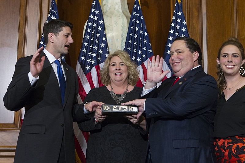 In this Jan. 3, 2017, file photo, House Speaker Paul Ryan of Wis. administers the House oath of office to Rep. Blake Farenthold, R-Texas, during a mock swearing in ceremony on Capitol Hill in Washington. The House Ethics Committee said Dec. 7 it is expanding its investigation into sexual harassment allegations against Farenthold. The committee said it will investigate whether Farenthold sexually harassed a former member of his staff and retaliated against her for complaining. The committee also said the panel would review allegations that Farenthold made inappropriate statements to other members of his official staff. ( AP Photo/Jose Luis Magana, File)