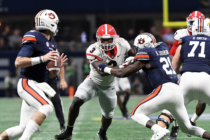 Georgia's triumph over Auburn last weekend in the SEC championship game also essentially served as a play-in game to college football's four-team playoff. Had the Bulldogs won with an eight-team format in place, both title-game participants would be in the playoff field, as would Alabama.