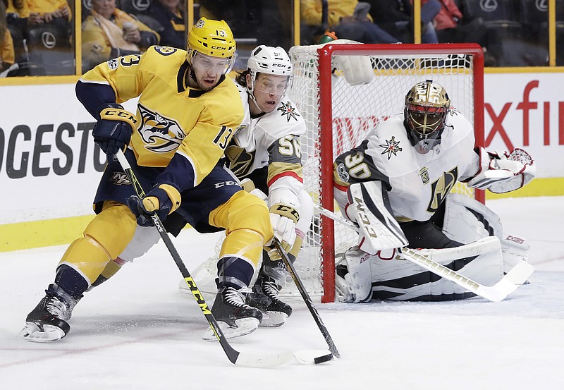 Nashville Predators defenseman Nick Bonino (13) skates around the net as Vegas Golden Knights left wing Erik Haula (56), of Finland, and goalie Malcolm Subban (30) defend during the second period of an NHL hockey game Friday, Dec. 8, 2017, in Nashville, Tenn. (AP Photo/Mark Humphrey)