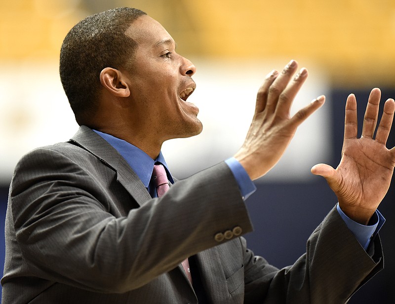 UTC head coach Lamont Paris directs the team from the sidelines.  The Charlotte 49ers visited the University of Chattanooga at Tennessee Mocs in basketball action at McKenzie Arena on December 10, 2017.