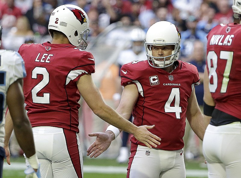 Arizona Cardinals kicker Phil Dawson (4) celebrates a field goal against the Tennessee Titans with Andy Lee (2) during the second half of an NFL football game, Sunday, Dec.10, 2017, in Glendale, Ariz. (AP Photo/Rick Scuteri)