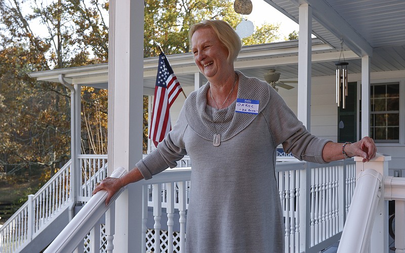Carol Jackson welcomes guests to her home in Sale Creek for a last shrimp boil before moving to South Carolina.