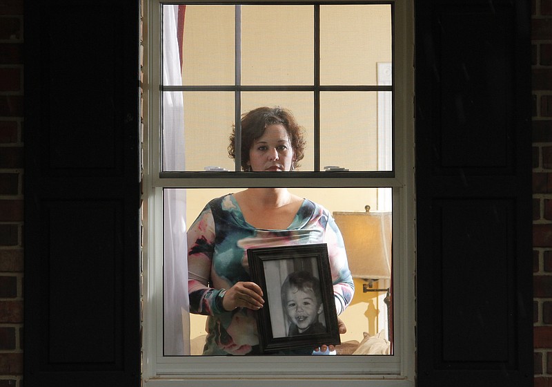 In this 2014 staff file photo, Erin Shero speaks about her two-year-old son Colton (pictured) who died one year ago today (to run friday - 10/17/14) after being caught in the cord on her window blinds. In the year since, Shero has grieved and become an advocate for window blind safety.