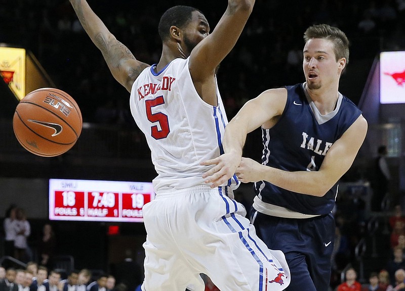 FILE - In this Nov. 22, 2015 FILE photo, Yale's Jack Montague, right, passes the ball around SMU's Markus Kennedy during an NCAA college basketball game in Dallas. Court documents show that Yale alumni are helping fund a lawsuit filed by Montague, who was expelled from the school for sexual misconduct. Montague told attorneys in a court deposition that between $25,000 and $30,000 has been raised from alumni to help fund the lawsuit, in which he claims he was wrongly expelled in 2016. He is seeking monetary damages and to be readmitted to the Ivy League school. (AP Photo/Tony Gutierrez, File)