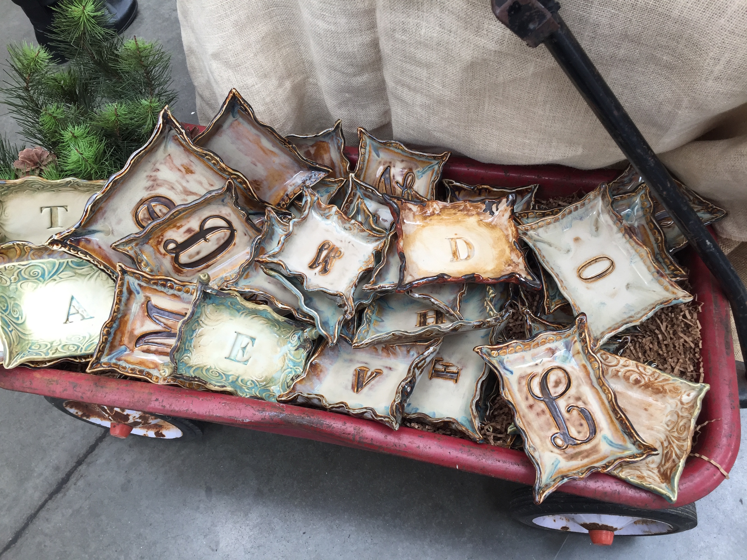 A gift personalized with an initial lets the recipient know it was picked especially with her in mind. These small, hand-formed, stoneware trays by artist Erich Emmenegger of Cloudland, Ga., feature a variety of designs and glazes. Use them as jewelry dishes, to hold coins and keys, or as decorative accents. Priced $20 to $36 according to size.