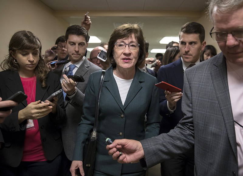 FILE- In this Nov. 30, 2017, file photo, with reporters looking for updates, Sen. Susan Collins, R-Maine, and other senators rush to the chamber to vote on amendments as the Republican leadership works to craft their sweeping tax bill in Washington. Collins said she is confident President Donald Trump and Senate Majority Leader Mitch McConnell will ensure passage of two bills aimed at shoring up the insurance markets, a demand she made before supporting the Republican tax overhaul. (AP Photo/J. Scott Applewhite, File)