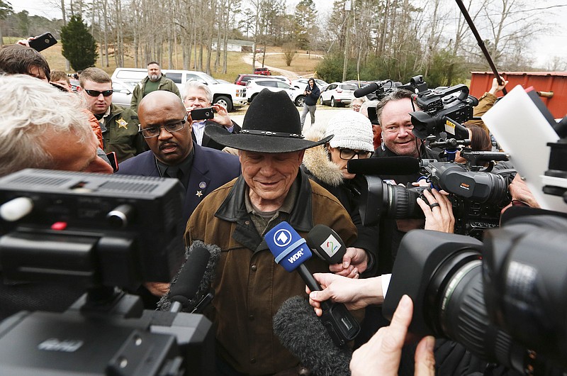 Republican U.S. Senate candidate Roy Moore talks to the media on election day as he votes, Tuesday, Dec. 12, 2017, in Gallant, Ala. (AP Photo/Brynn Anderson)