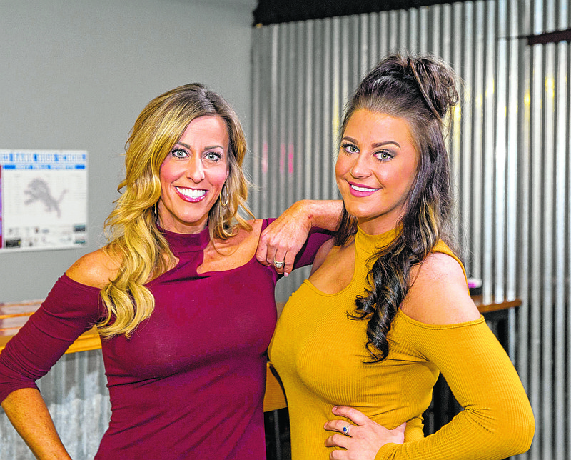 Tami Smith and Felisha Rehagen in the lobby of Nooga-Q. (Photo by Mark Gilliland)