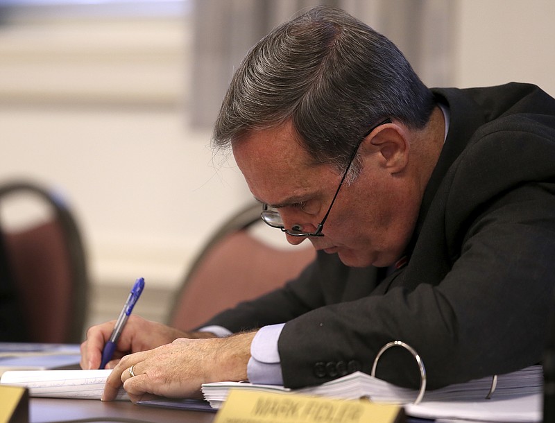 David Fowler, with the Constitutional Government Defense Fund, takes notes during a hearing before Judge Mike Pemberton in the courtroom at the Cleveland Municipal Building on Wednesday, Dec. 13, 2017, in Cleveland, Tenn. Fowler, on behalf of Bradley County Commissioner Howard Thompson and Kinser Church of God Pastor Guinn Green, filed a lawsuit to prevent Bradley County from issuing marriage licenses in response to the U.S. Supreme Court ruling allowing same-sex marriage. 