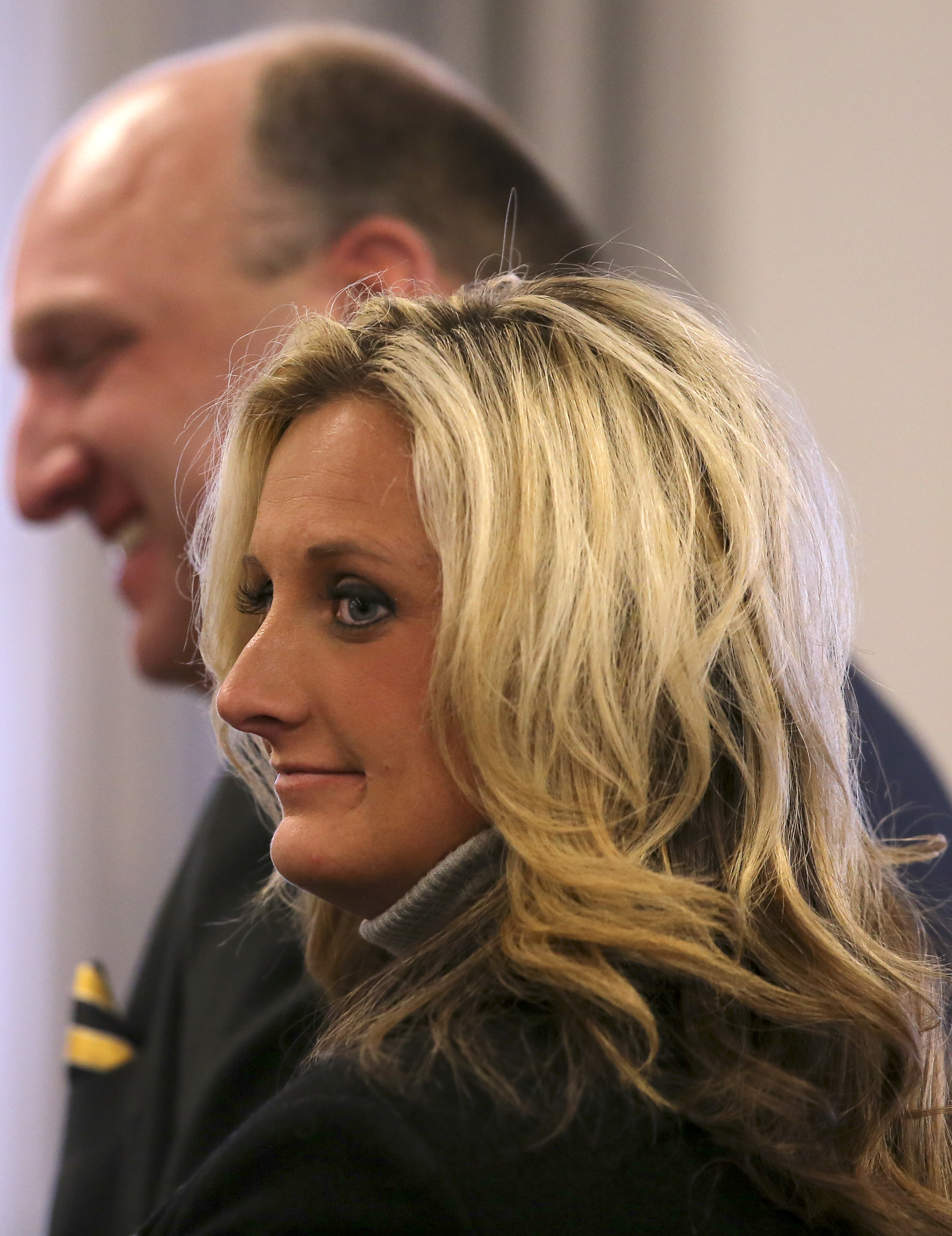 Tenille Watson prepares to leave with her husband, Bradley County Sheriff Eric Watson, after a motions hearing in the courtroom at the Cleveland Municipal Building on Wednesday, Dec. 13, 2017 in Cleveland, Tenn. Sheriff Watson is being charged with 12 felonies in relation to forged vehicle registrations.