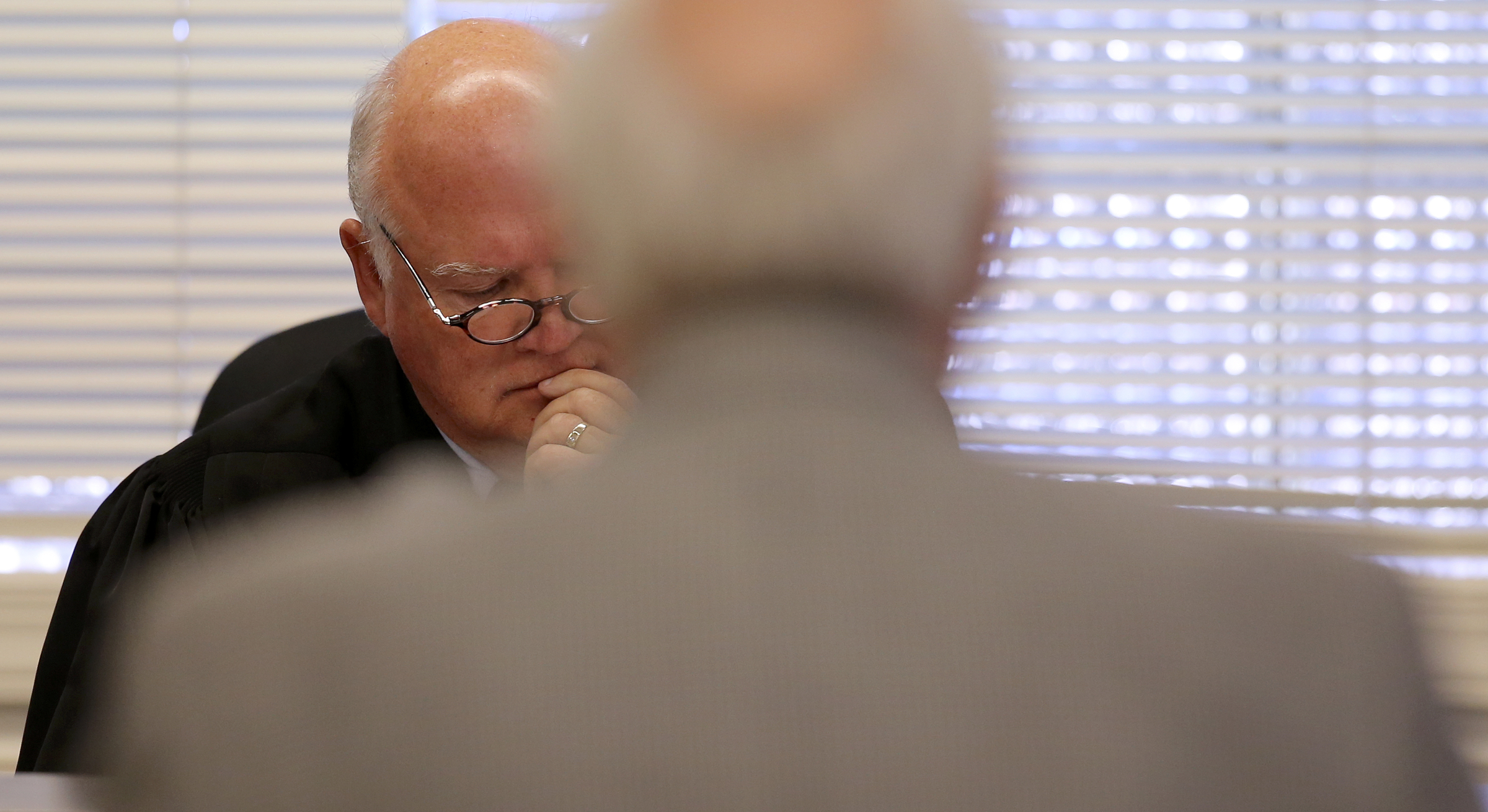 Judge Don Ash listens to James F. Logan Jr., Bradley County Sheriff Eric Watson's attorney, during a hearing on a motion to dismiss felony counts against Sheriff Watson in the courtroom at the Cleveland Municipal Building on Wednesday, Dec. 13, 2017 in Cleveland, Tenn. Sheriff Watson is being charged with 12 felonies in relation to forged vehicle registrations.