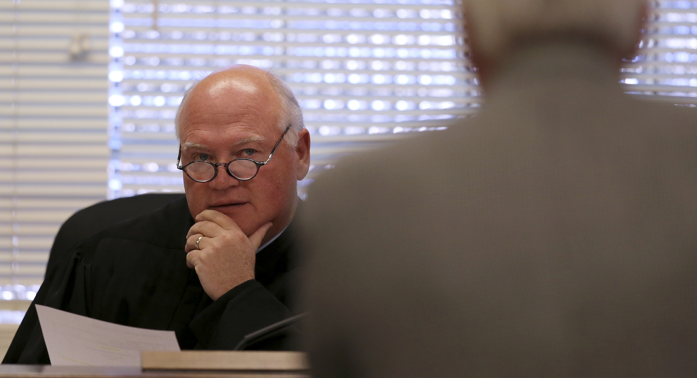 Judge Don Ash listens to James F. Logan Jr., Bradley County Sheriff Eric Watson's attorney, during a hearing on a motion to dismiss felony counts against Sheriff Watson in the courtroom at the Cleveland Municipal Building on Wednesday, Dec. 13, 2017 in Cleveland, Tenn. Sheriff Watson is being charged with 12 felonies in relation to forged vehicle registrations.