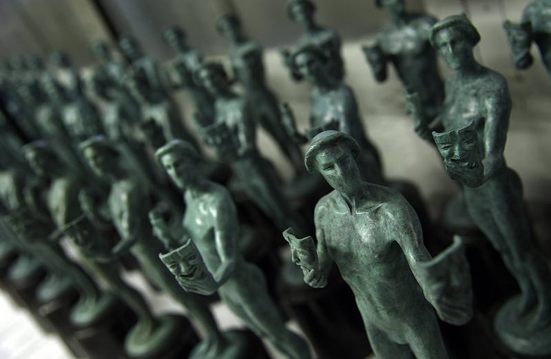 
              FILE - This Jan. 17, 2017 file photo shows solid bronze Actor statuettes for the Screen Actors Guild awards displayed at the American Fine Arts Foundry in Burbank, Calif. The SAG Awards nominations for achievements in film and television will be announced on Wednesday, Dec. 13. (Photo by Chris Pizzello/Invision/AP, File)
            