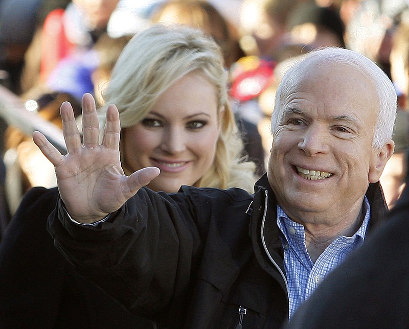 
              FILE - In this Oct. 30, 20087 file photo, Republican presidential candidate Sen. John McCain, R-Ariz., accompanied by his daughter Meghan McCain, waves to supporters as he enters a campaign rally in Defiance, Ohio.  Former Vice President Joe Biden sought to console the daughter of ailing Sen. John McCain after she began crying while discussing her father’s cancer on ABC’s “The View.” McCain is battling the same aggressive type of brain cancer that killed Biden’s son Beau in 2015.  (AP Photo/Stephan Savoia)
            