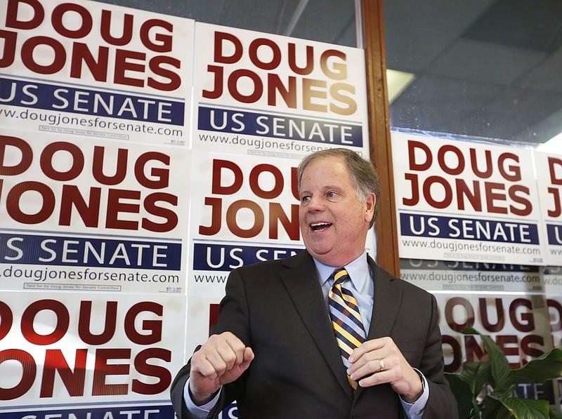 In this Dec. 10, 2017, photo, Doug Jones speaks during a campaign rally in Birmingham, Ala. Jones, a Democrat who once prosecuted two Ku Klux Klansmen in a deadly church bombing and has now broken the Republican lock grip on Alabama, is the state's new U.S. senator.(AP Photo/Brynn Anderson)