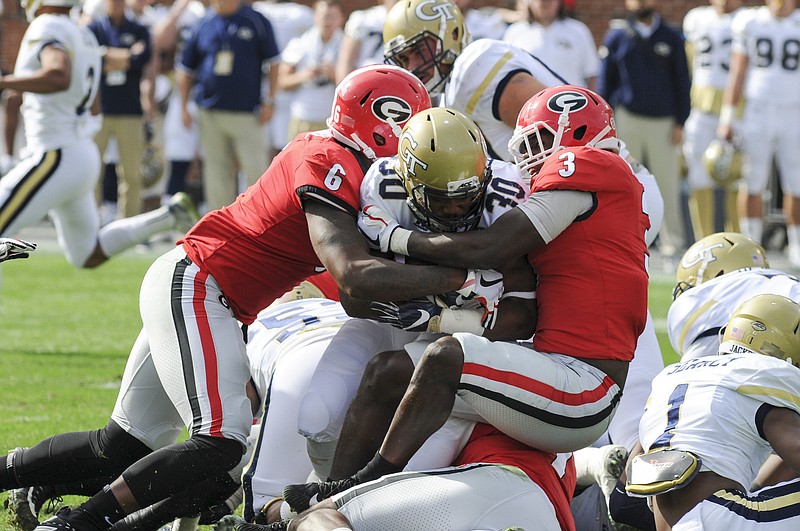 Georgia junior inside linebacker Natrez Patrick (6), shown here making a stop along with Roquan Smith at Georgia Tech last month, had a misdemeanor marijuana possession charge dropped this week.