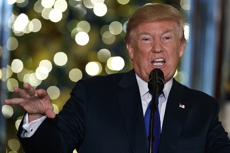 President Donald Trump speaks on tax reform in the Grand Foyer of the White House, Wednesday, Dec. 13, 2017, in Washington. (AP Photo/Evan Vucci)