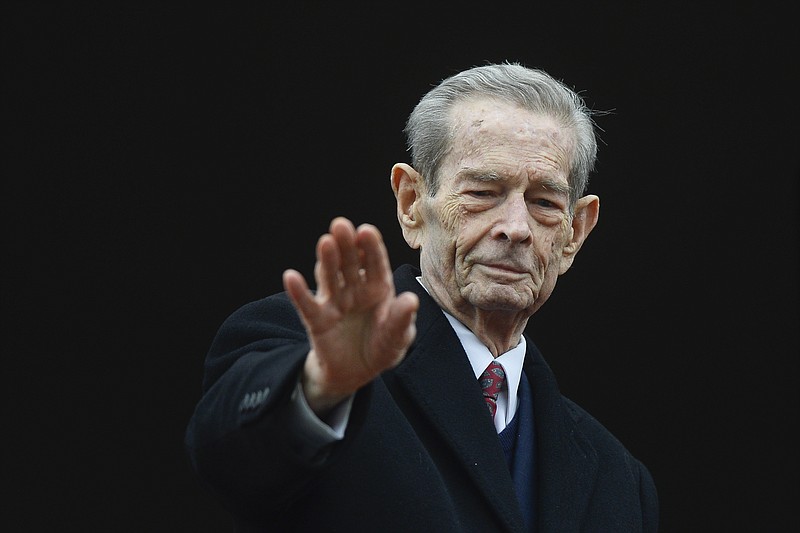 
              FILE - In this Wednesday, Nov. 19, 2014 file picture, Romania's former King Michael waves to supporters during an appearance at the Elisabeta Palace in Bucharest, Romania. Thousands of Romanians on Thursday Dec. 14, 2017 paid their respects to the late King Michael I whose coffin is lying in state at the Royal Palace before his funeral this weekend.
Michael, who ruled Romania twice and was forced to abdicate by the communists in 1947, died Dec. 5 in Switzerland at age 96. (AP Photo/Octav Ganea, File)
            