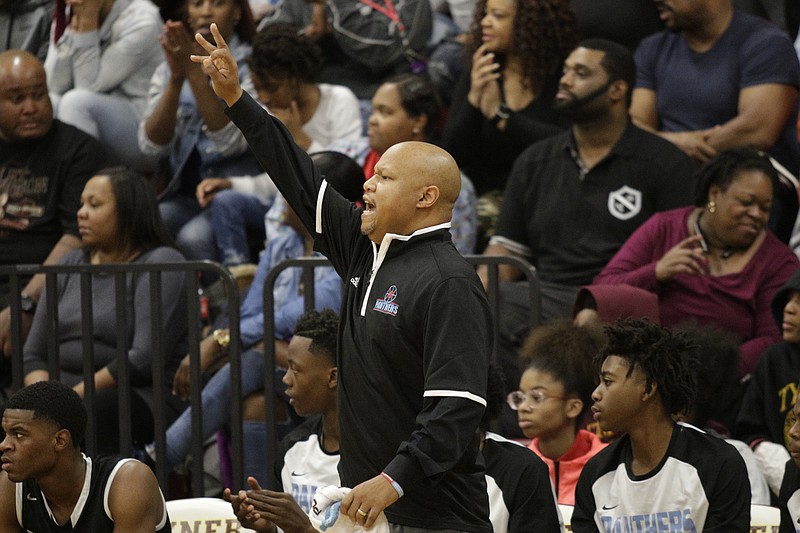 Brainerd basketball coach Levar Brown shouts directions during their prep basketball game at Tyner Academy on Friday, Dec. 15, 2017, in Chattanooga, Tenn.