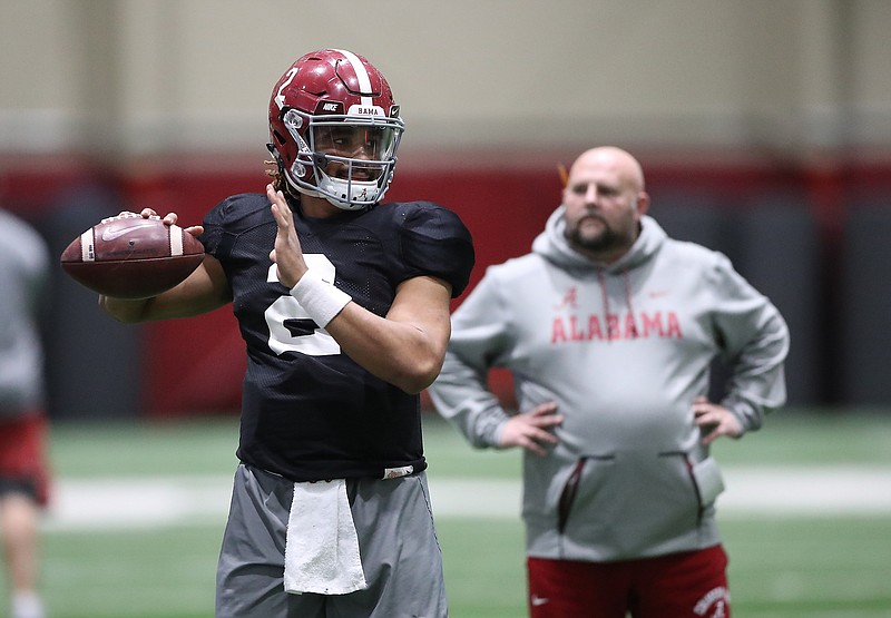 Alabama sophomore quarterback Jalen Hurts practices Friday while offensive coordinator Brian Daboll watches. Crimson Tide defensive coordinator Jeremy Pruitt, who's also the new head coach at Tennessee, missed Friday's workout and will return to Tuscaloosa on Sunday.