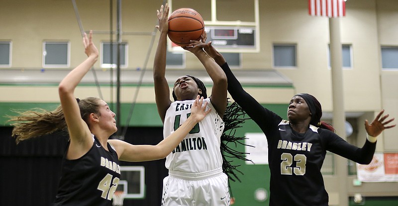 Bradley Central's Rhyne Howard (23) fouls East Hamilton's Eliziah Laboo (45) at East Hamilton Middle/High School on Monday, Dec. 18, 2017 in Ooltewah, Tenn.