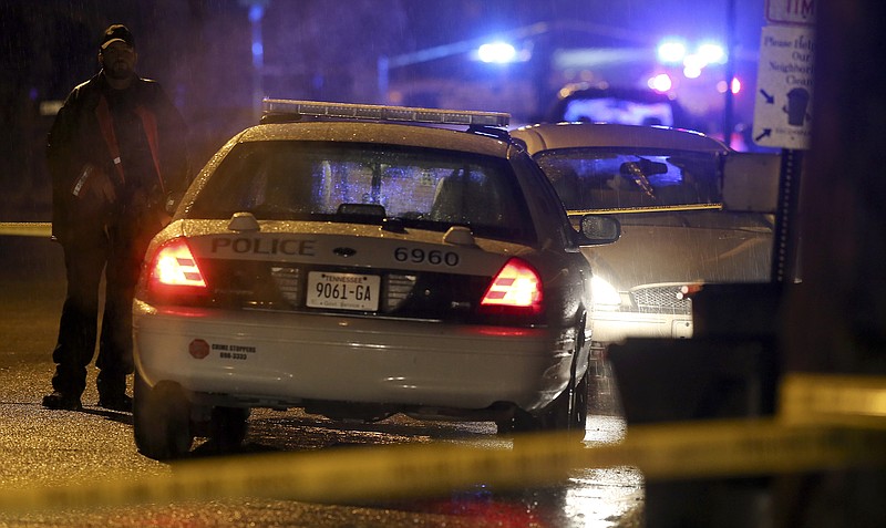 Law enforcement investigate a shooting along Highland Avenue on Tuesday, Dec. 19, 2017, in Chattanooga.