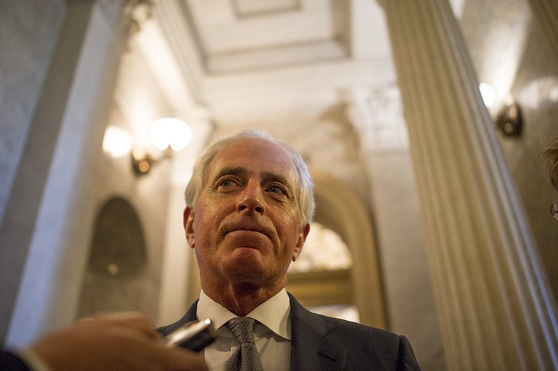Sen. Bob Corker, R-Tenn., speaks to reporters earlier this month after he was the lone Republican 'no' vote as the Senate passed the most sweeping tax rewrite in decades. Now he's a 'yes' vote. (Justin Gilliland/The New York Times)