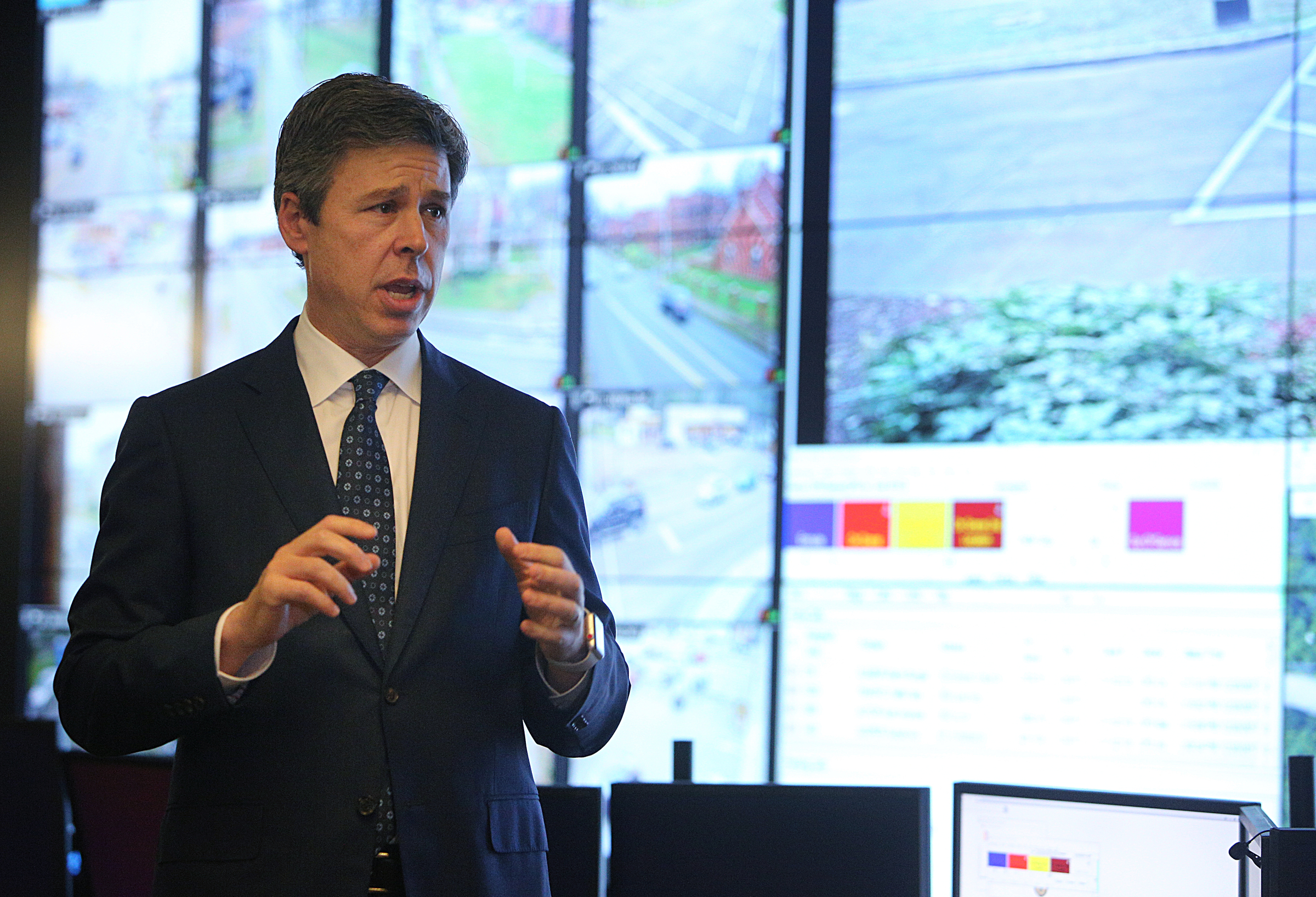 Chattanooga Mayor Andy Berke talks about the new Safe Exchange Zone Wednesday, Dec. 20, 2017 at the Police Service Center in Chattanooga, Tenn. The Safe Exchange Zone is located in the parking lot of the Police Service Center where two parking spaces are marked off with green paint and are monitored by police officers in the Real Time Intelligence Center inside the building.