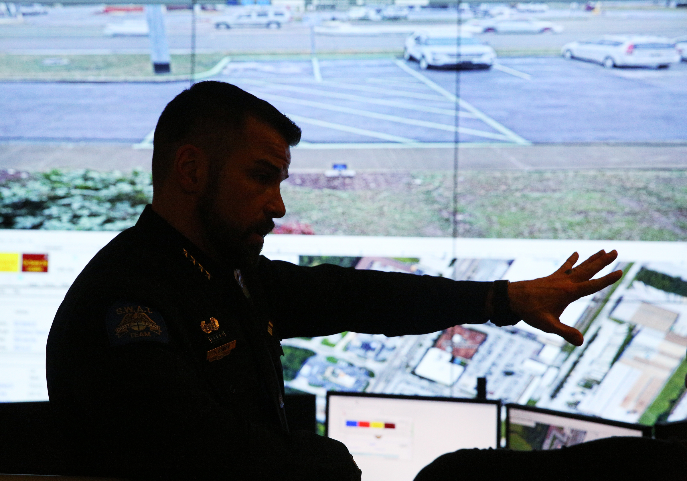 Chattanooga Police Chief David Roddy points to the screen where the new Safe Exchange Zone is shown Wednesday, Dec. 20, 2017 in the Real Time Intelligence Center at the Police Service Center in Chattanooga, Tenn. The Chattanooga Police Department has established a Safe Exchange Zone in the parking lot in front of the Police Service Center on Amnicola Highway, so people who are buying or selling items online have a safe location to meet and exchange money for goods.