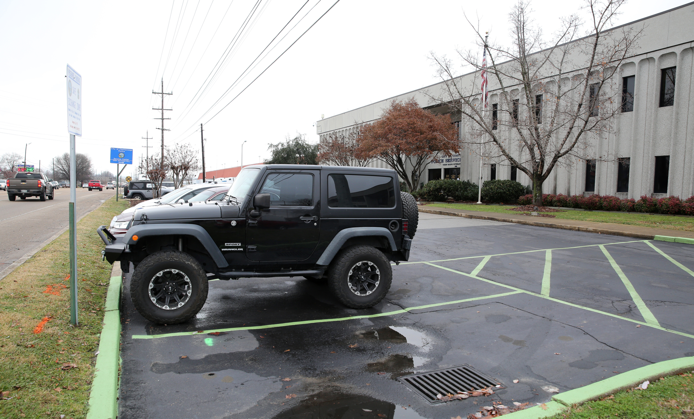 Two parking spaces deemed a Safe Exchange Zone are marked off with green paint Wednesday, Dec. 20, 2017 in front of the Police Service Center in Chattanooga, Tenn. The Chattanooga Police Department has established a Safe Exchange Zone in the parking lot in front of the Police Service Center on Amnicola Highway, so people who are buying or selling items online have a safe location to meet and exchange money for goods.