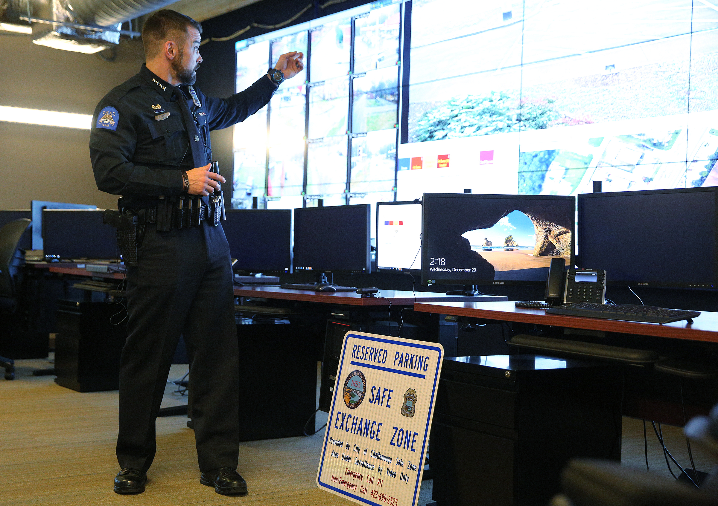 Chattanooga Police Chief David Roddy points to the screen where the new Safe Exchange Zone is shown Wednesday, Dec. 20, 2017 in the Real Time Intelligence Center at the Police Service Center in Chattanooga, Tenn. The Chattanooga Police Department has established a Safe Exchange Zone in the parking lot in front of the Police Service Center on Amnicola Highway, so people who are buying or selling items online have a safe location to meet and exchange money for goods.