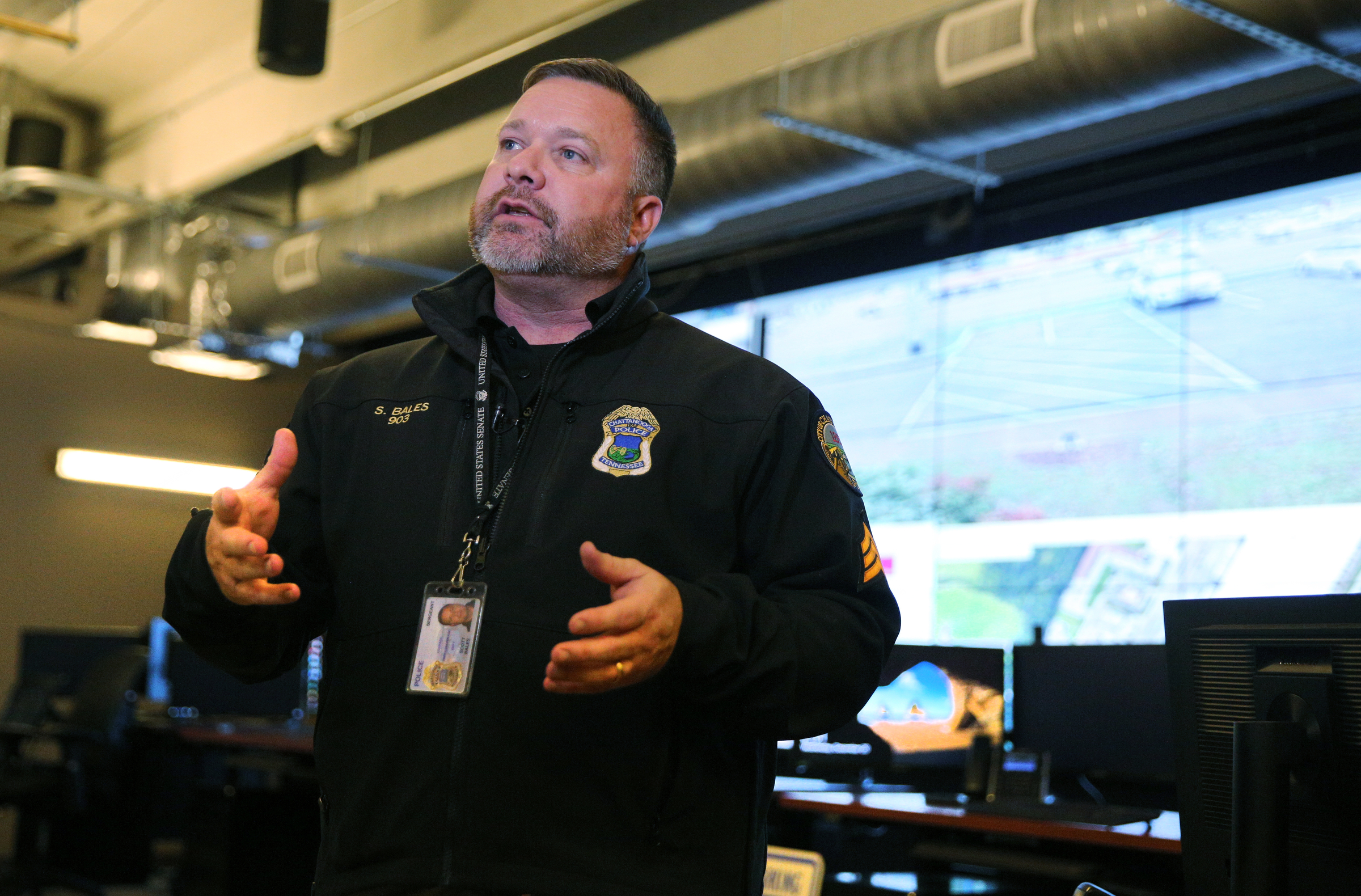 Chattanooga Police Department Sgt. Scott Bales talks about the idea behind the new Safe Exchange Zone Wednesday, Dec. 20, 2017 at the Police Service Center in Chattanooga, Tenn. The Safe Exchange Zone is located in the parking lot of the Police Service Center where two parking spaces are marked off with green paint and are monitored by police officers in the Real Time Intelligence Center inside the building.