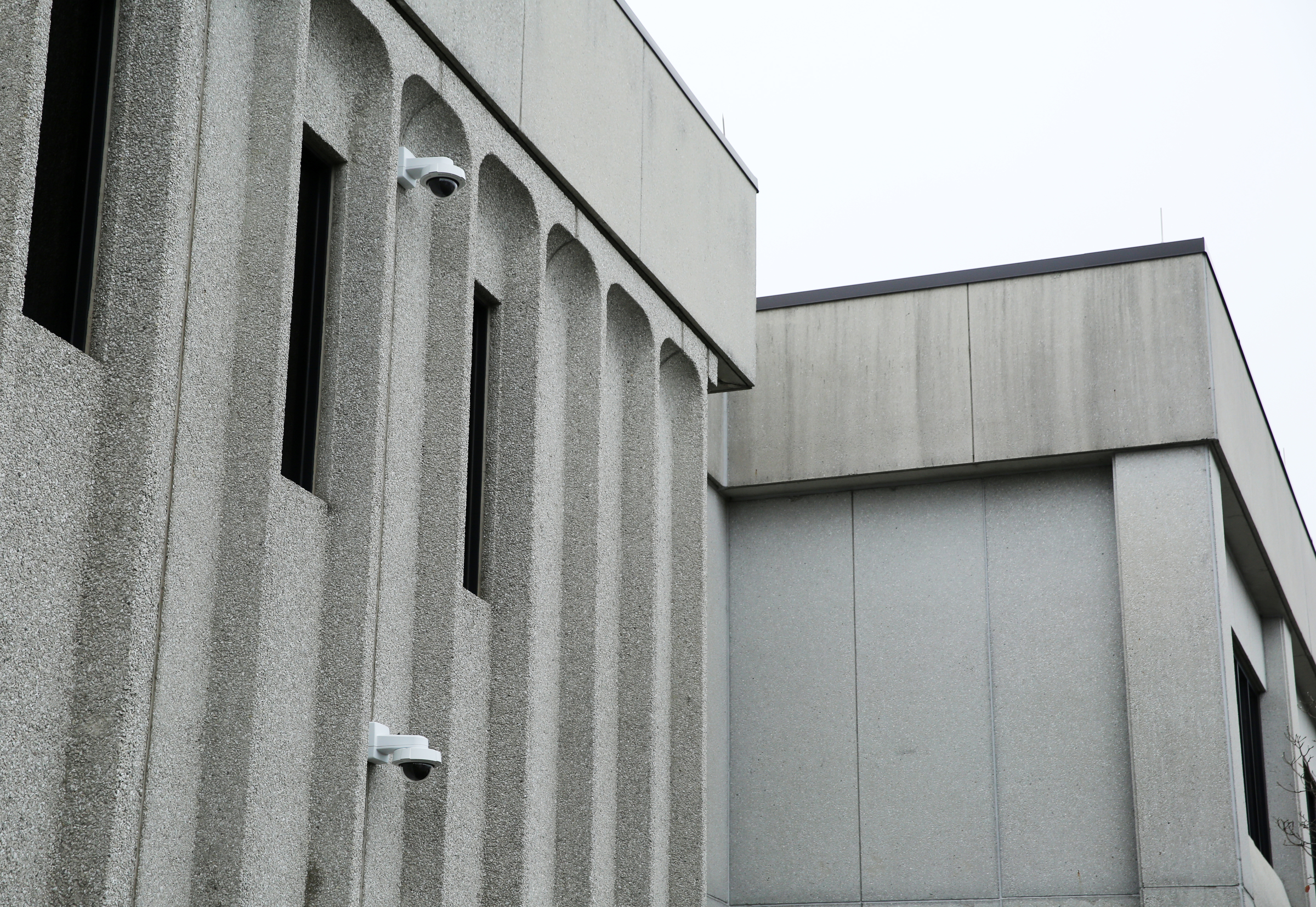 Cameras are located on the front side of the Police Service Center Wednesday, Dec. 20, 2017 in Chattanooga, Tenn. The cameras monitor the new Safe Exchange Zone which is located in the parking lot of the Police Service Center where two parking spaces are marked off with green paint.