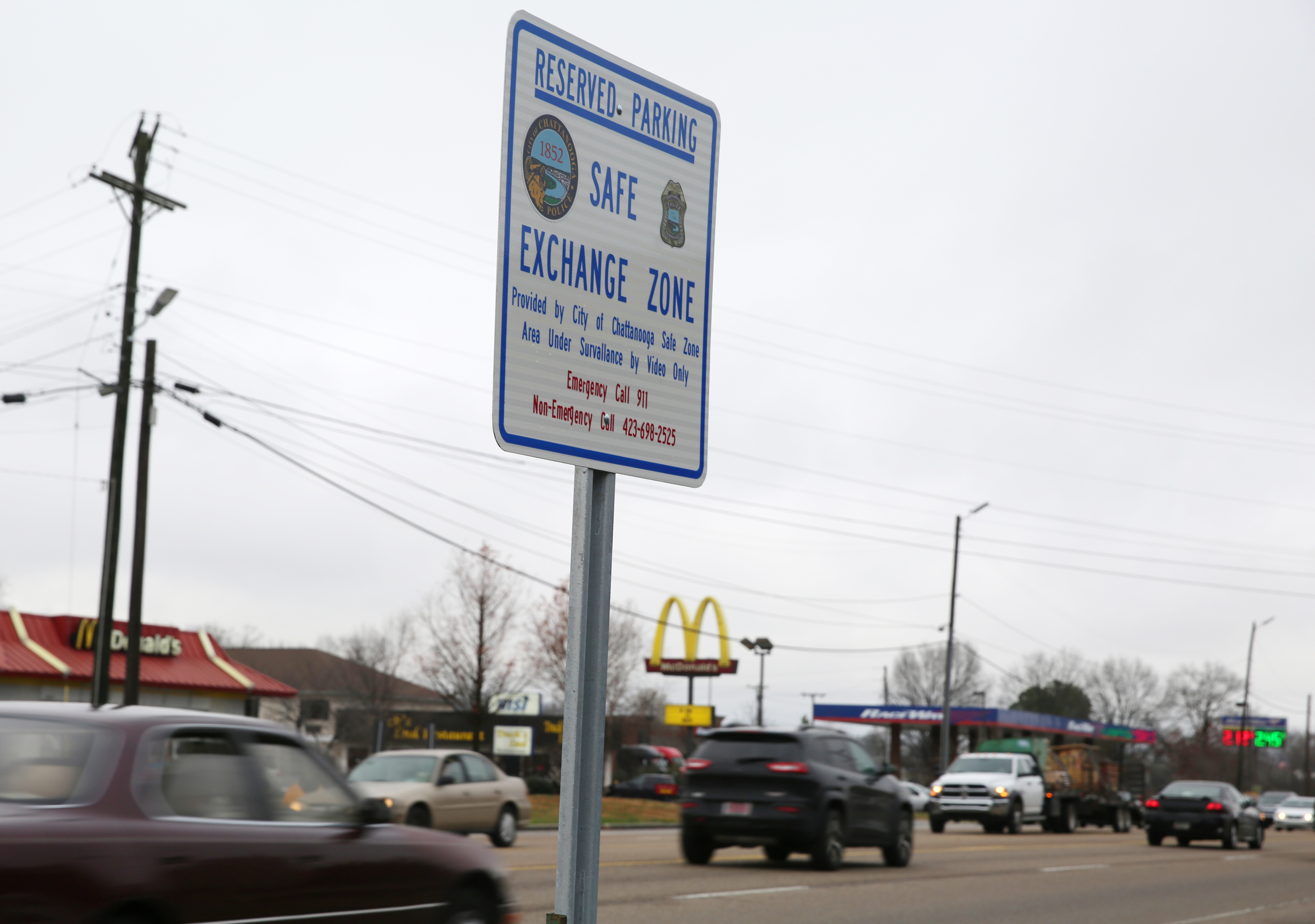A sign indicating a Safe Exchange Zone is located in front of the Police Service Center in Chattanooga, Tenn. The Chattanooga Police Department has established a "Safe Exchange Zone" in the parking lot in front of the Police Service Center on Amnicola Highway, so people who are buying or selling items online have a safe location to meet and exchange money for goods.