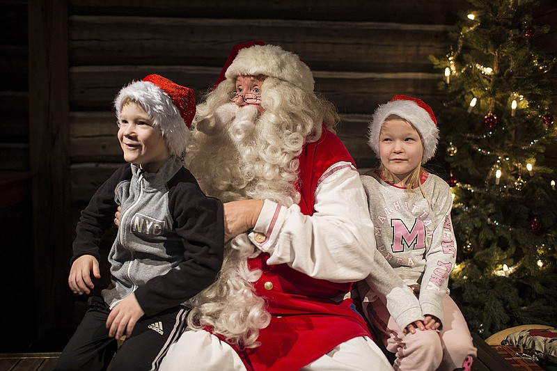 Kari Eskeli plays Santa Claus in Rovaniemi, Finland, Dec. 18, 2017. This remote city near the Arctic Circle claims to be the "Official Hometown of Santa Claus," and hundreds of thousands visit each year, many from lands like China, with no Christmas traditions.