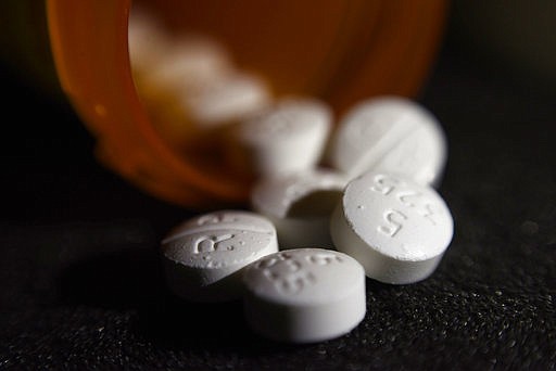 Abuse of opioids such as the oxycodone-acetaminophen pictured have led to a second straight year of life expectancy in the United States to be lowered.